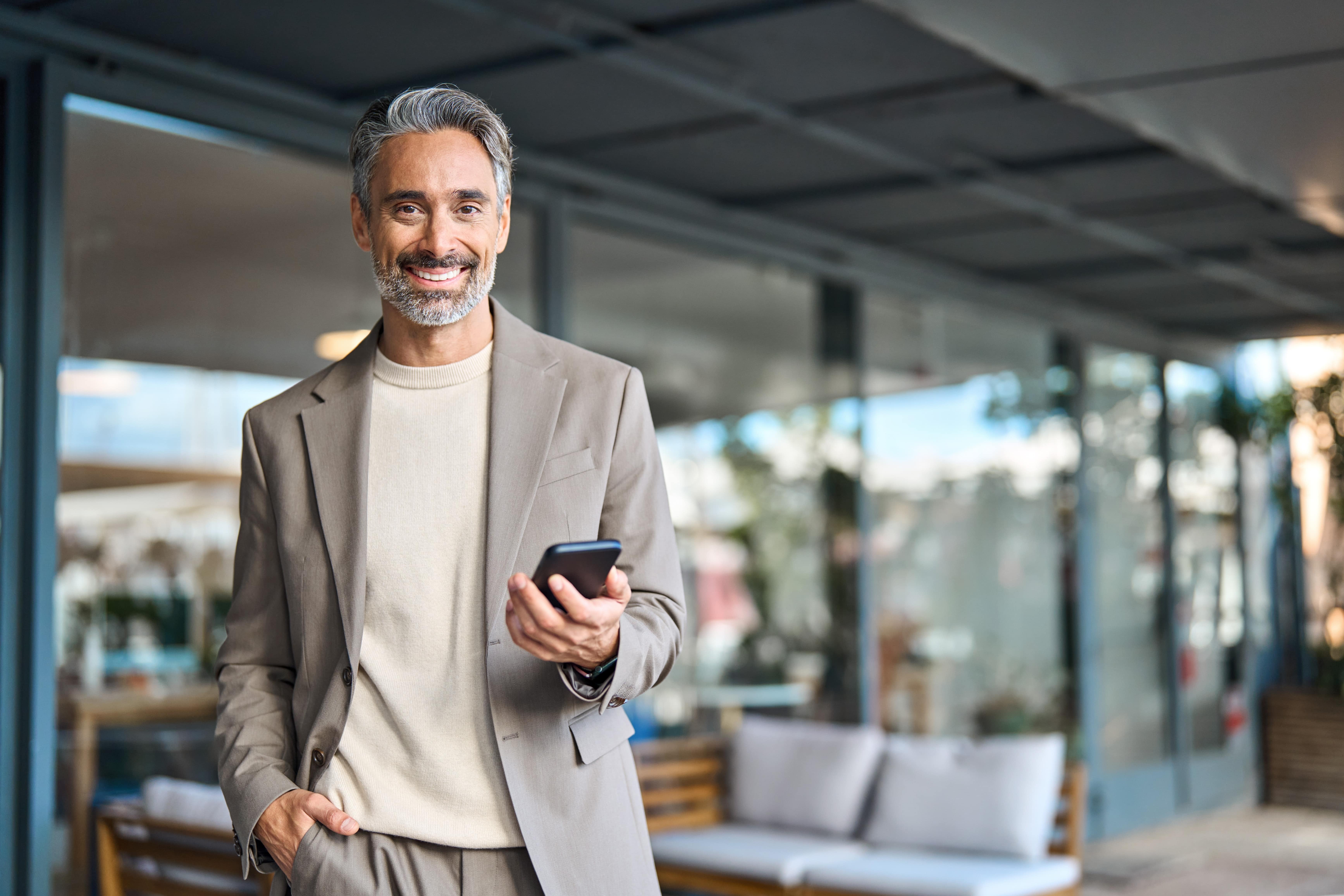 businessman standing outside his furniture store